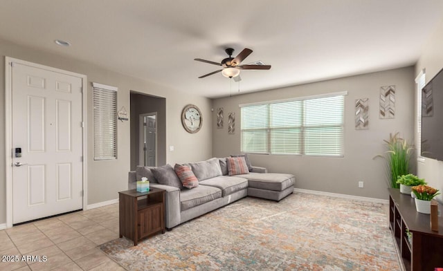 3914 S 58th Ln, Phoenix, AZ 85043 - living room featuring a ceiling fan, baseboards, and light tile patterned flooring