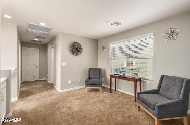 3914 S 58th Ln, Phoenix, AZ 85043 - sitting room featuring light carpet, baseboards, and recessed lighting