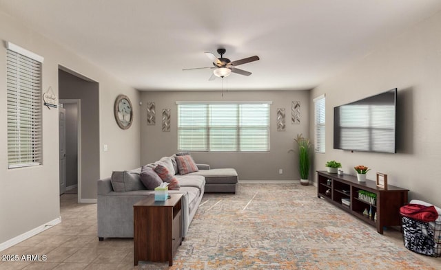 3914 S 58th Ln, Phoenix, AZ 85043 - tiled living room featuring a ceiling fan and baseboards