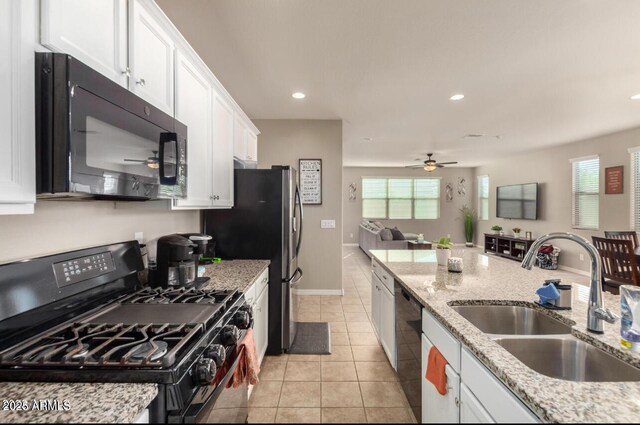 3914 S 58th Ln, Phoenix, AZ 85043 - kitchen featuring black appliances, a sink, a ceiling fan, white cabinets, and open floor plan