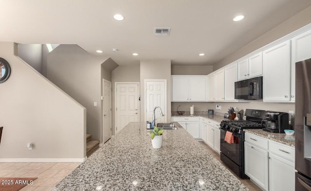 3914 S 58th Ln, Phoenix, AZ 85043 - kitchen with black appliances, a sink, white cabinetry, recessed lighting, and light stone counters