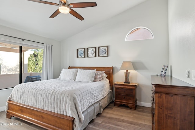 bedroom featuring ceiling fan, lofted ceiling, light hardwood / wood-style floors, and access to outside