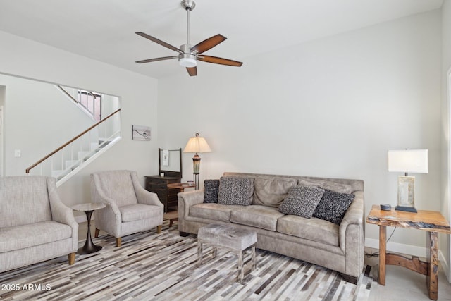 living room featuring light wood-type flooring and ceiling fan