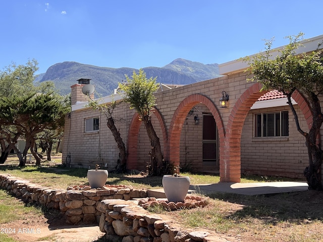 exterior space featuring a mountain view