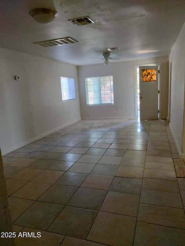 6706 N 54th Dr, Glendale, AZ 85301 - tiled empty room with a ceiling fan and baseboards