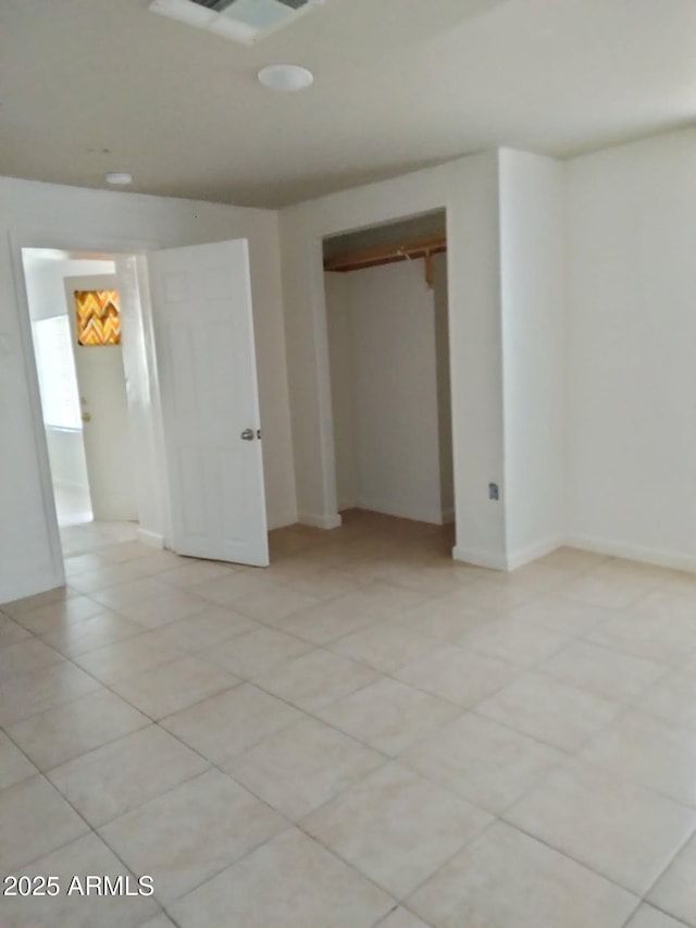 6706 N 54th Dr, Glendale, AZ 85301 - unfurnished bedroom with a closet and light tile patterned floors