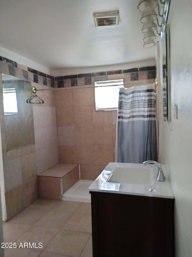 6706 N 54th Dr, Glendale, AZ 85301 - full bathroom with tiled shower, plenty of natural light, and vanity