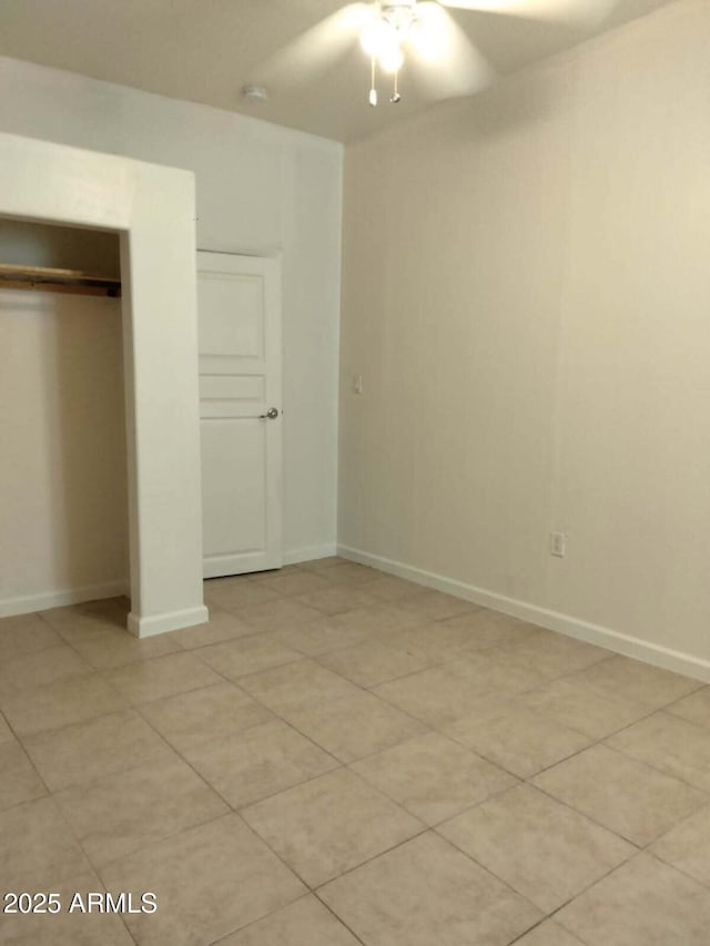 6706 N 54th Dr, Glendale, AZ 85301 - unfurnished bedroom with a closet, ceiling fan, baseboards, and light tile patterned flooring