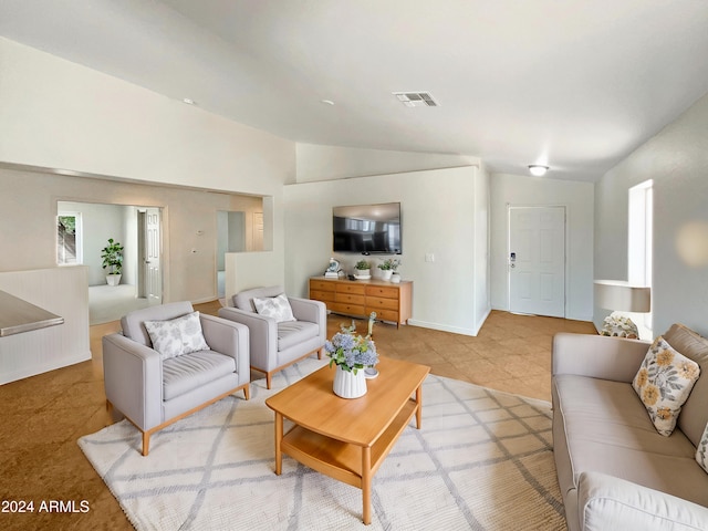 tiled living room with lofted ceiling