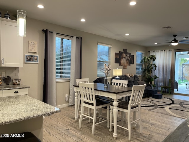 dining room with baseboards, visible vents, recessed lighting, ceiling fan, and light wood-type flooring