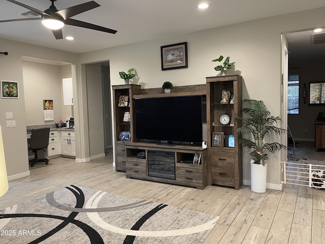 living area featuring recessed lighting, light wood-style floors, visible vents, and ceiling fan