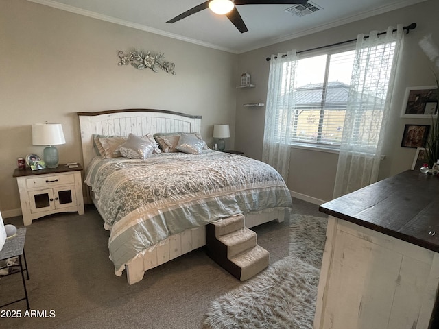 bedroom featuring visible vents, ornamental molding, dark carpet, baseboards, and ceiling fan