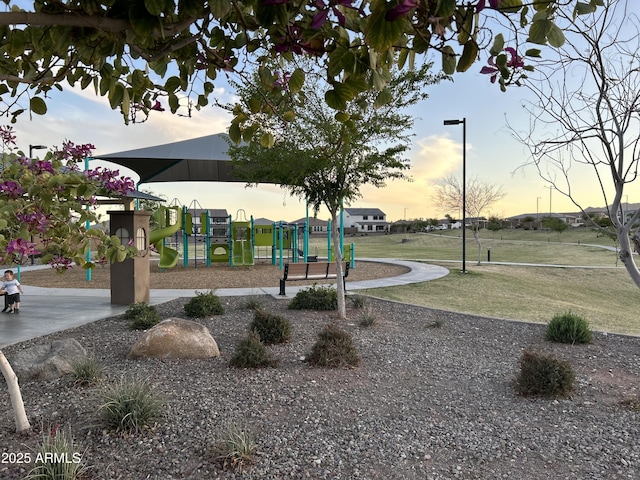 playground at dusk with a lawn and playground community