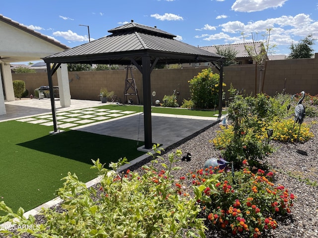 view of patio / terrace featuring a gazebo and a fenced backyard