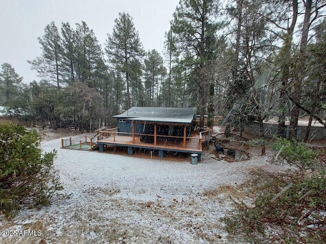 rear view of house with a wooden deck