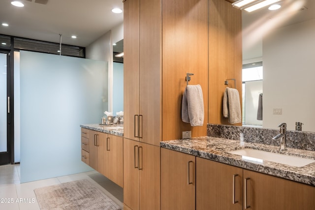 bathroom with vanity and tile patterned floors