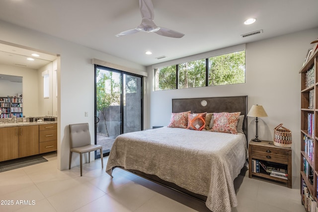 bedroom featuring ensuite bathroom, sink, access to outside, and ceiling fan