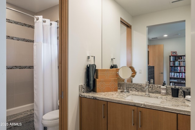 bathroom with a shower with curtain, vanity, and toilet