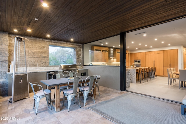 dining room featuring wooden ceiling