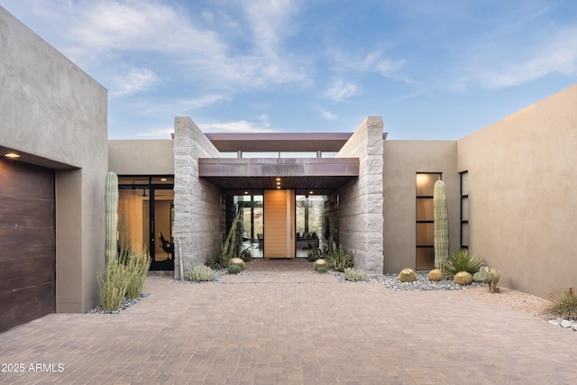 view of exterior entry featuring a garage