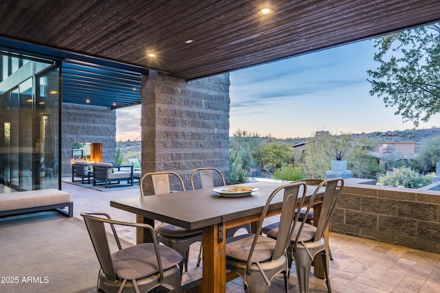 view of patio terrace at dusk