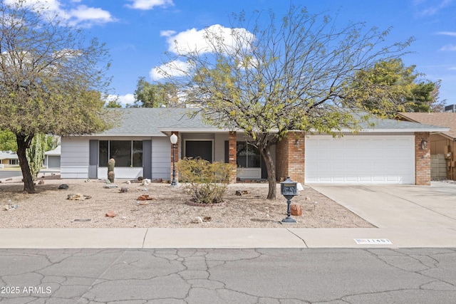 ranch-style home featuring brick siding, roof with shingles, concrete driveway, and an attached garage