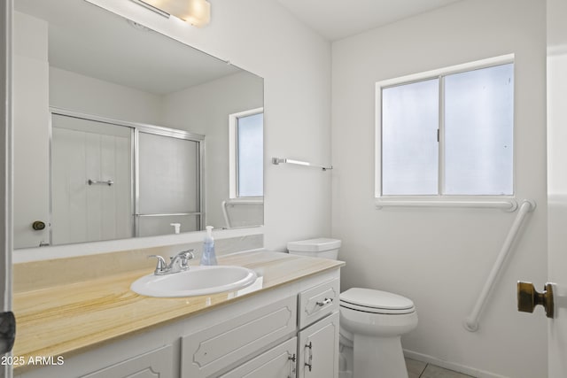 full bath with plenty of natural light, a stall shower, toilet, and vanity