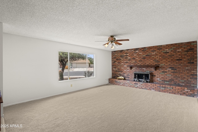 unfurnished living room with ceiling fan, carpet, and a textured ceiling