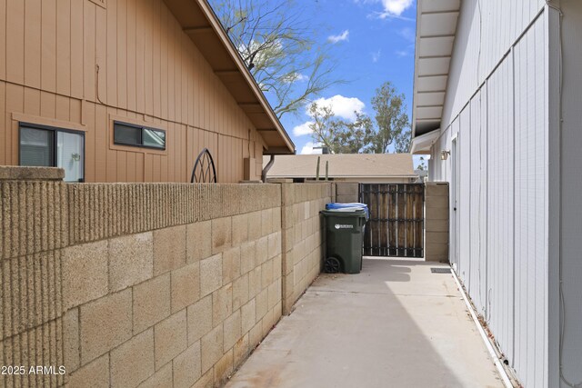 view of side of property featuring fence