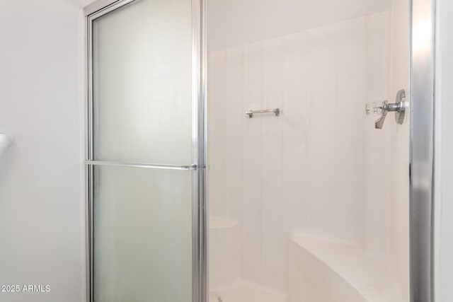 full bathroom featuring a shower stall