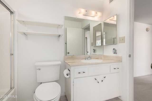 bathroom with toilet and vanity