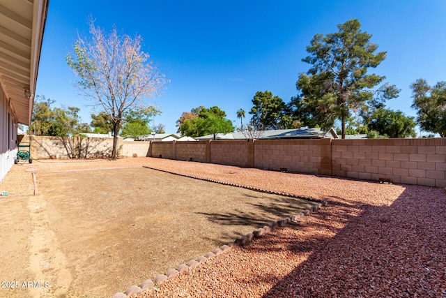 view of yard with a fenced backyard