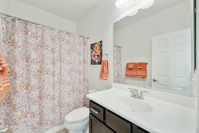 bathroom featuring a shower with curtain, toilet, and vanity