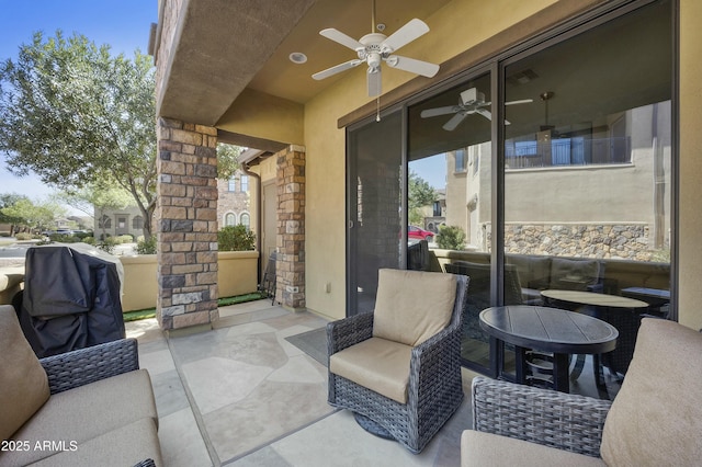 view of patio featuring a ceiling fan