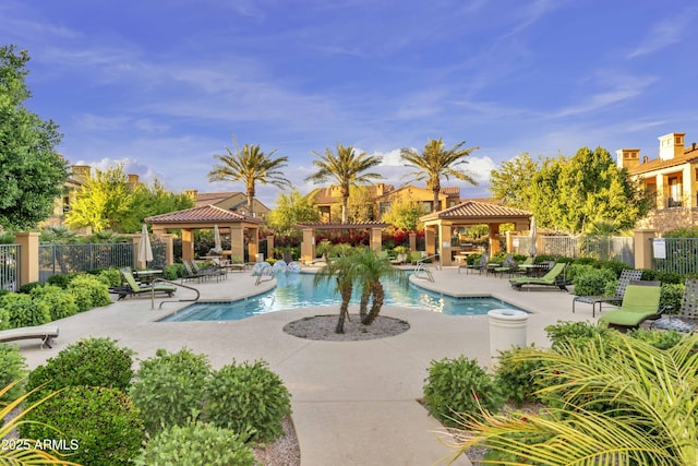 pool featuring a gazebo, a patio, and fence