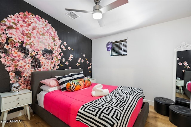 bedroom featuring ceiling fan and wood-type flooring