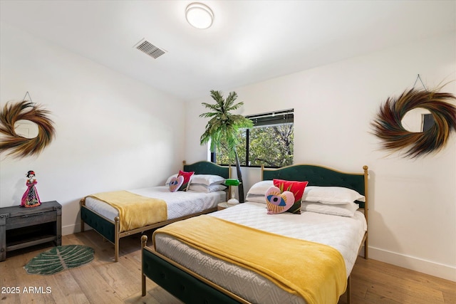 bedroom featuring wood-type flooring