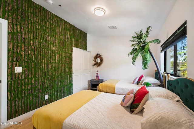 bedroom with wood-type flooring