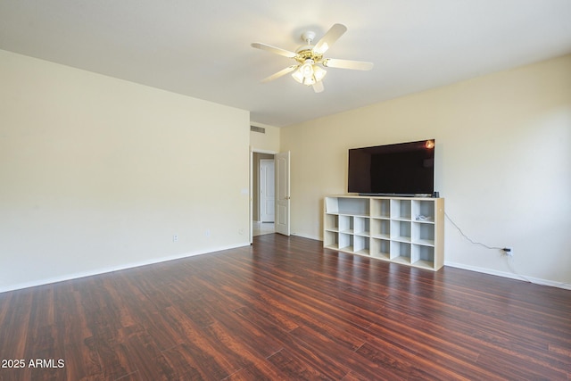 unfurnished living room featuring a ceiling fan, visible vents, baseboards, and wood finished floors