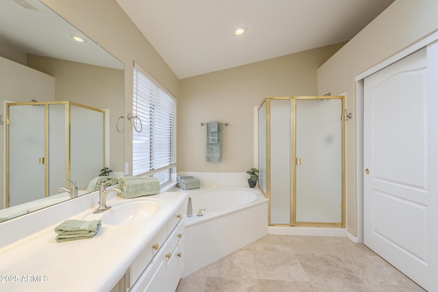 bathroom featuring lofted ceiling, a stall shower, and a garden tub