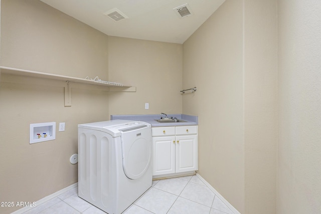 clothes washing area with washer / dryer, cabinet space, visible vents, and light tile patterned floors