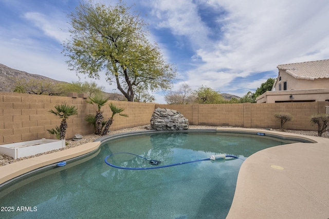view of swimming pool with a fenced backyard and a fenced in pool
