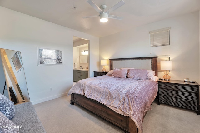 carpeted bedroom featuring ceiling fan and connected bathroom