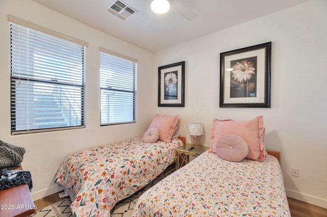 bedroom with hardwood / wood-style flooring and ceiling fan