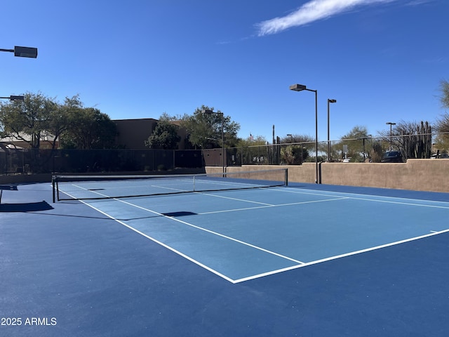 view of tennis court featuring basketball court