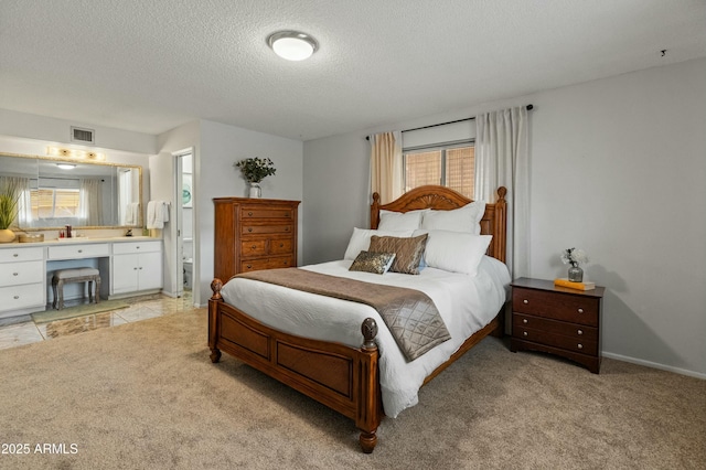 bedroom featuring visible vents, light carpet, and multiple windows