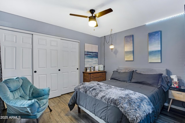 bedroom featuring hardwood / wood-style floors, a closet, and ceiling fan