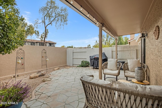 view of patio / terrace featuring an outdoor hangout area and grilling area