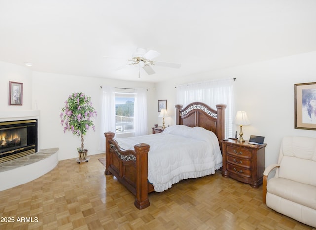 11430 E Manzanita Trl, Dewey, AZ 86327 - bedroom featuring a glass covered fireplace and ceiling fan