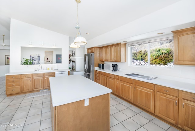 11430 E Manzanita Trl, Dewey, AZ 86327 - kitchen featuring appliances with stainless steel finishes, light countertops, light tile patterned floors, a center island, and lofted ceiling